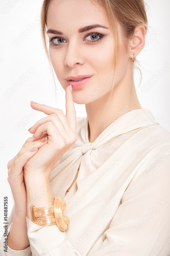 portrait of beautiful young sensual blonde woman in white shirt smiling and looking at camera portrait of beautiful young sensual blonde woman in white shirt smiling and looking at camera