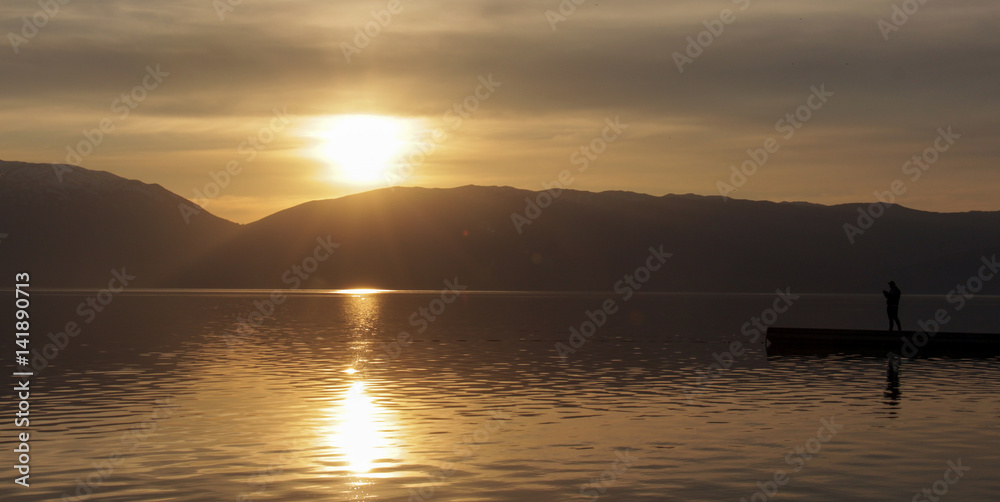 Magnificent scenery of sunset over lake prespa in macedonia