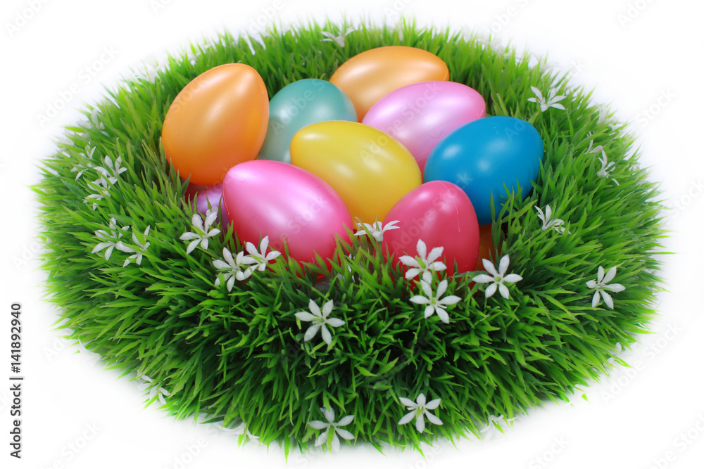 Easter eggs in green nest on white Easter eggs in green nest on white