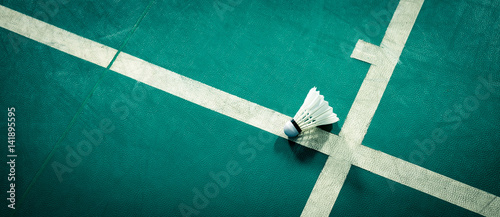 shuttlecock on badminton playing court 