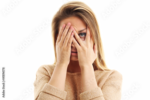 Afraid woman looking at camera isolated on a white background