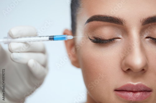 Cosmetic Treatment. Facial Skin Lifting Injection To Woman Face