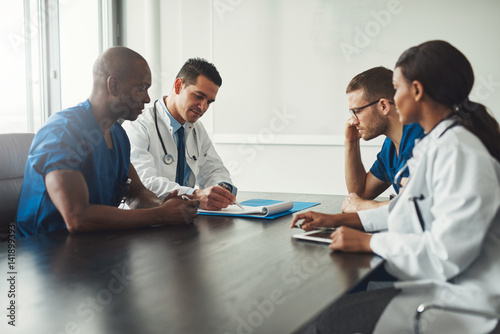 Multiracial medical team having a meeting photo