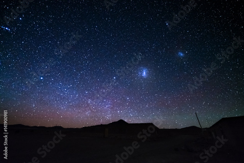 Fototapeta Naklejka Na Ścianę i Meble -  The majestic Magellanic Clouds, outstandingly bright, captured from the Andea highlands in Bolivia, South America.