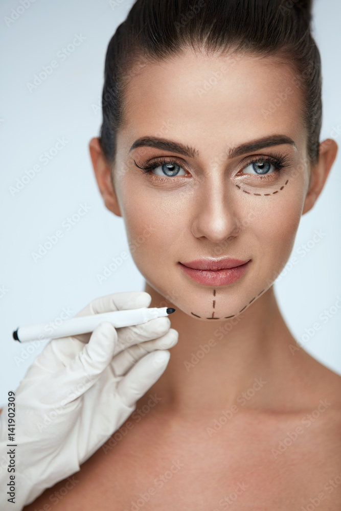Treatment. Beautician Drawing Surgical Lines On Woman Face Treatment. Beautician Drawing Surgical Lines On Woman Face