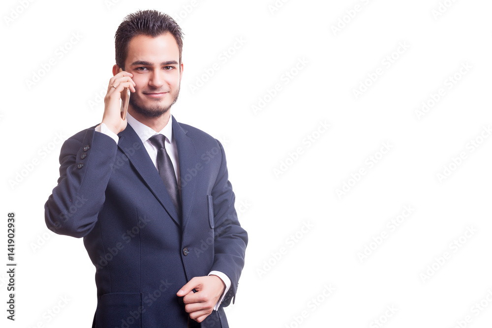 Man in business suit with a phone in hands Man in business suit with a phone in hands