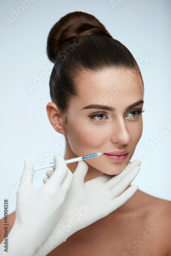 Plastic Surgery. Beautiful Woman Face Getting Beauty Injections