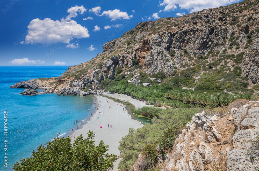 Preveli Beach in Crete island, Greece.  There is a palm forest and a river inside the gorge near this beach.