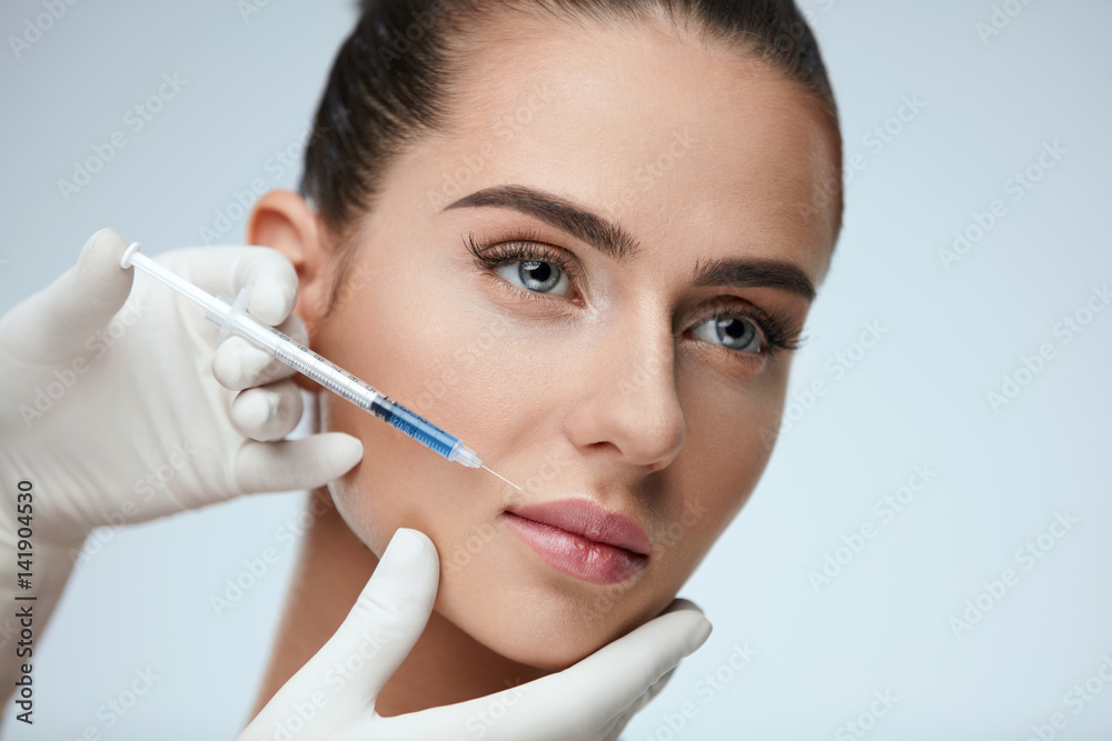 Portrait Of Beautiful Young Woman Getting Cosmetic Treatment