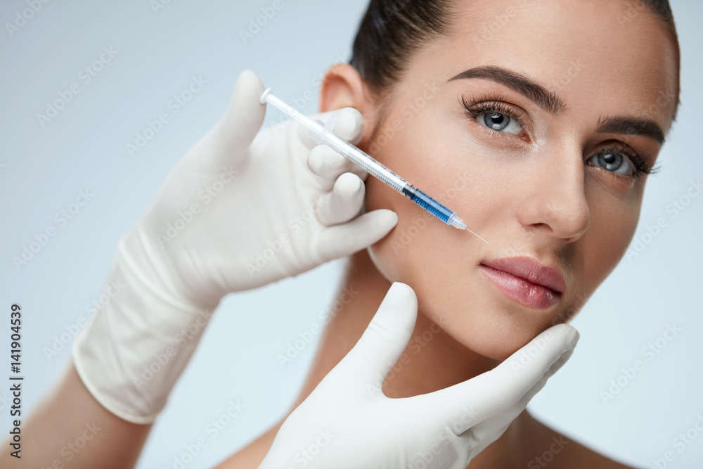 Portrait Of Beautiful Young Woman Getting Cosmetic Treatment Portrait Of Beautiful Young Woman Getting Cosmetic Treatment