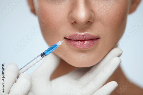 Quadro su tela Lip Augmentation. Young Woman Lips Receiving Beauty Injection