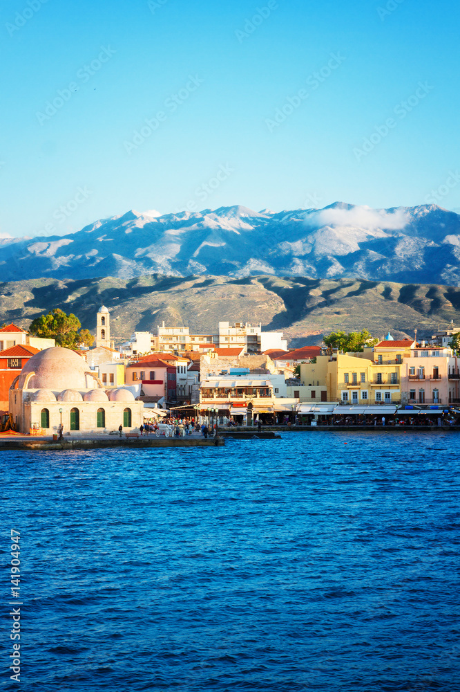 historical houses and Aegan sea at sunny day, Chania, Crete, Greece, retro toned