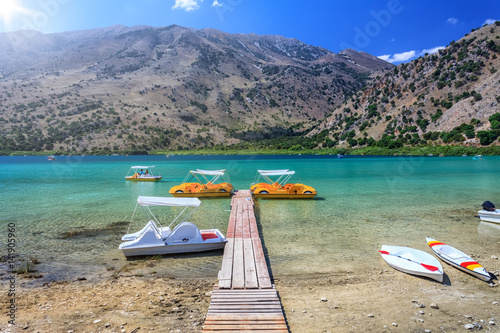 Pedal boats standing at the pier. Greece.