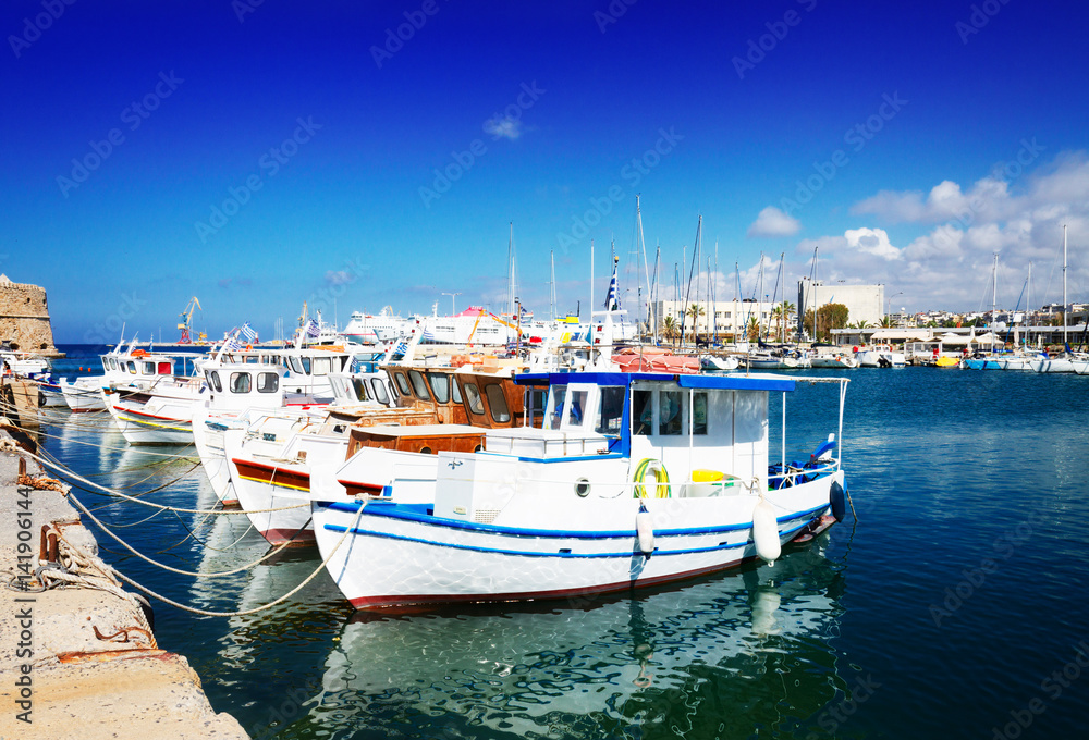 colorful fishing boats near old fortress, Heraklion port, Crete, Greece, retro toned