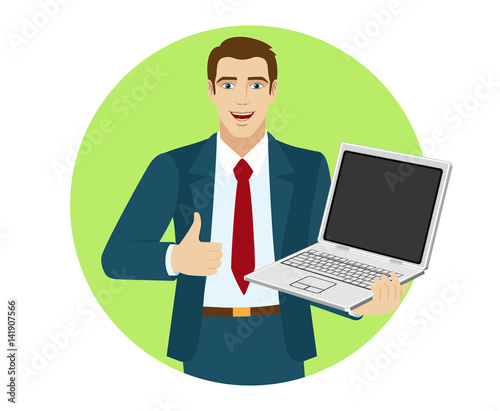 Businessman holding laptop notebook and showing the thumb up