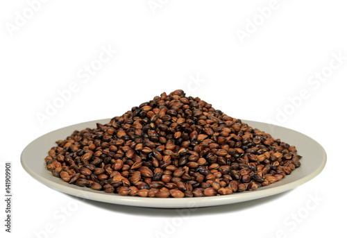 Pile of Roasted Barley for Brewing Barley Tea, in a White Plate on White Background 