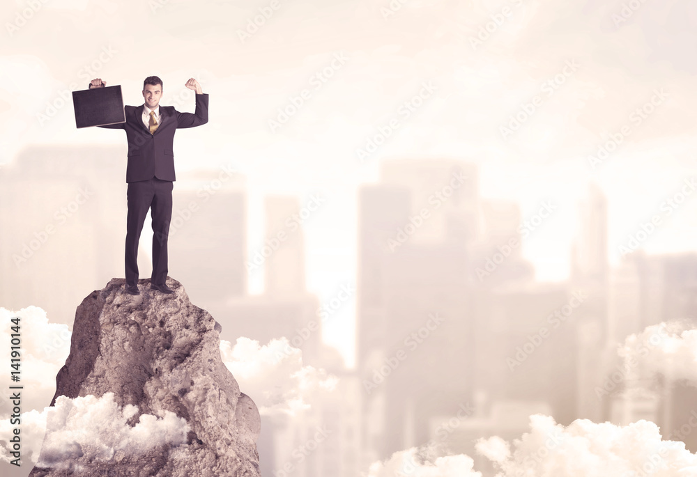 Confident businessman on dangerous cliff Confident businessman on dangerous cliff