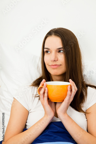 Beautiful Woman Having Coffee In Bed