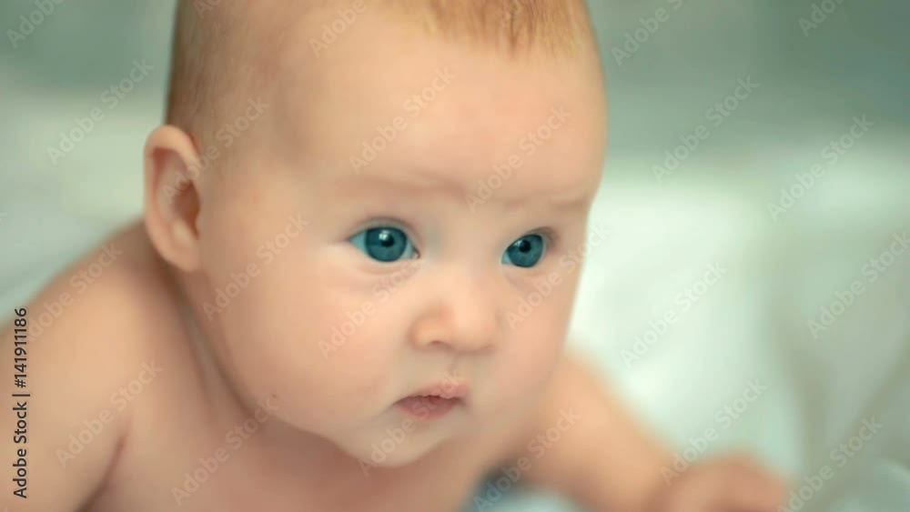 Angelic little baby lying in his bed. Healthcare. Happy childhood Angelic little baby lying in his bed. Healthcare. Happy childhood
