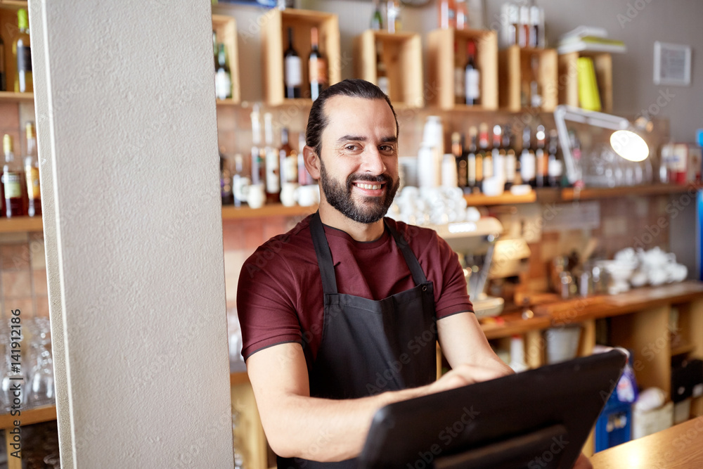 Fototapeta premium happy man or waiter at bar cashbox