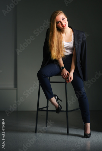 Young woman sitting on a chair