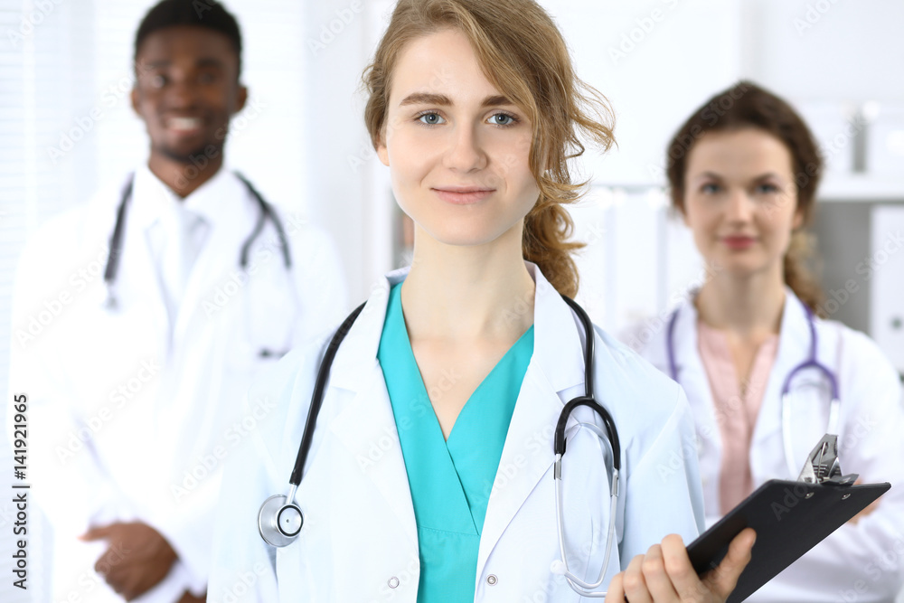 Medical team of confident doctors showing Ok sign and ready to help. Medicine and health care, insurance concept Medical team of confident doctors showing Ok sign and ready to help. Medicine and health care, insurance concept