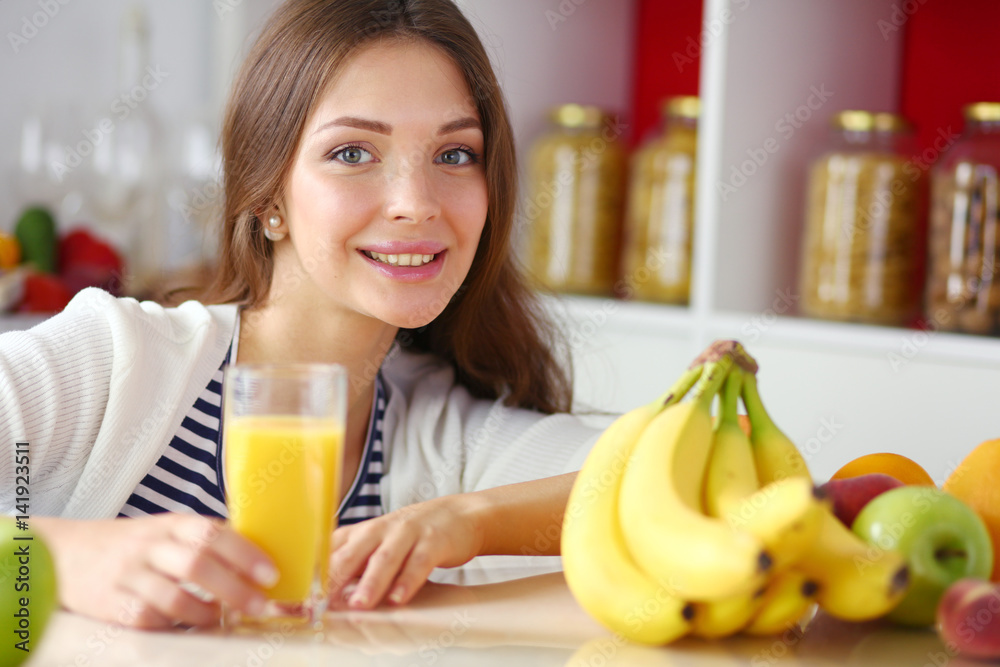 Portrait of a pretty woman holding glass with tasty juice Portrait of a pretty woman holding glass with tasty juice