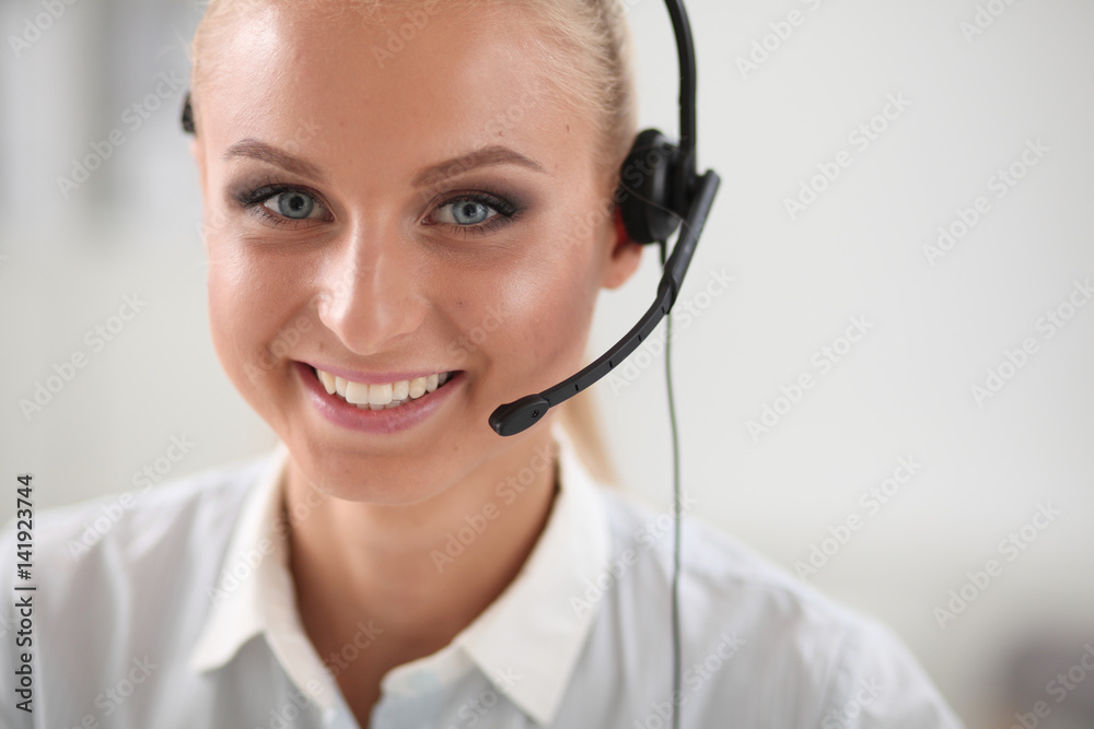Close-up portrait of a customer service agent sitting at office Close-up portrait of a customer service agent sitting at office