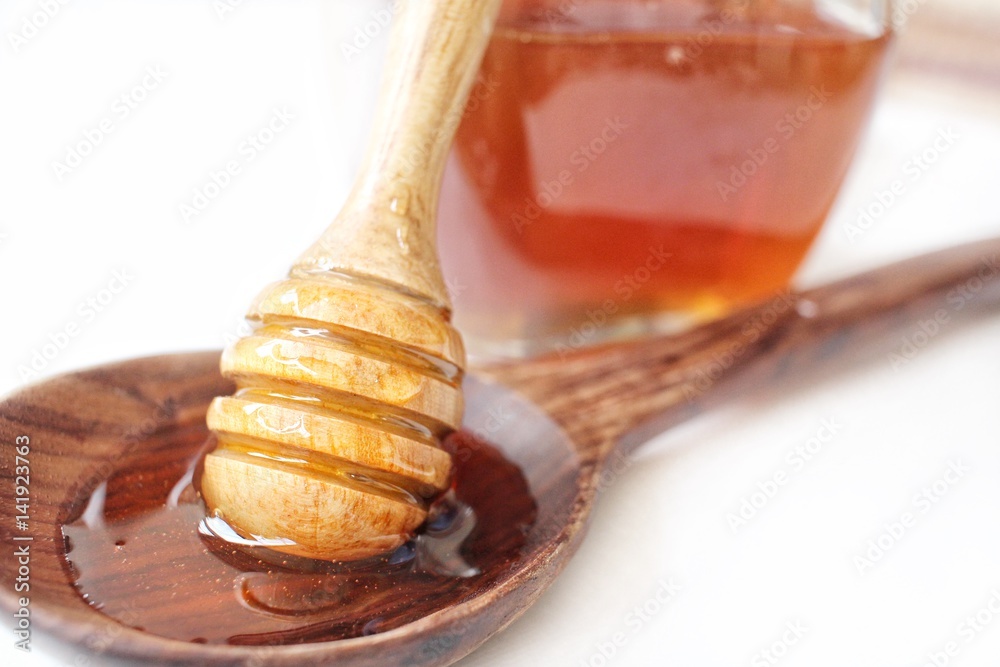 Fresh honey with honey dipper