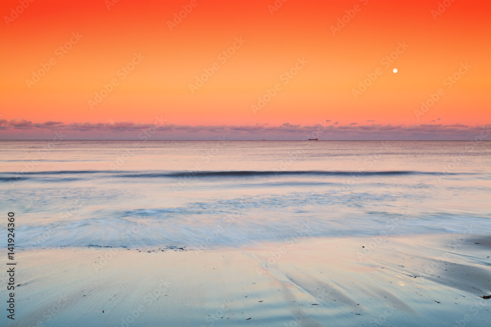 Evening Sky with Rising Moon over Sea