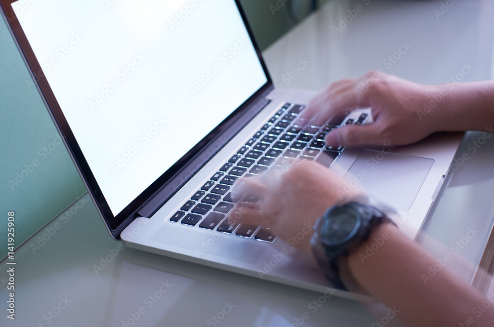 Hand typing on the laptop keyboard quickly ,hand is motion blur effect. Hand typing on the laptop keyboard quickly ,hand is motion blur effect.