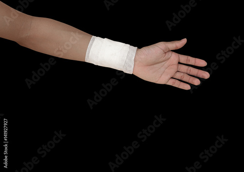 gauze bandage patient with hand wrap injury isolated on black background and clipping path