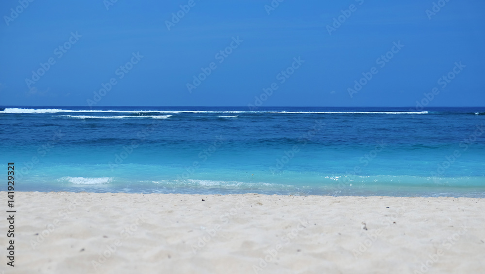 Beach background /A beach is a landform along a body of water. It usually consists of loose particles, which are often composed of rock, such as sand, gravel, shingle, pebbles