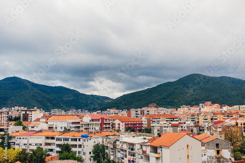 New homes in Budva, Montenegro. New town. Real estate on the shores of the Adriatic Sea. House with orange roof tiles