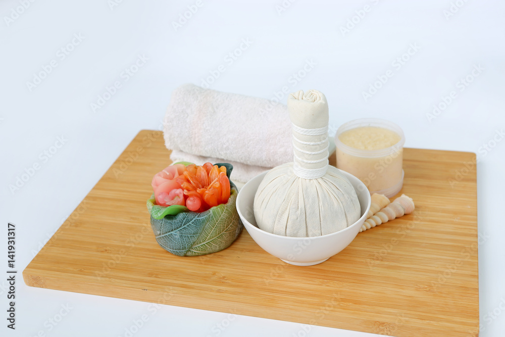 Spa herbal compressing ball with towels and Salt Scrub, Spa concept background Spa herbal compressing ball with towels and Salt Scrub, Spa concept background
