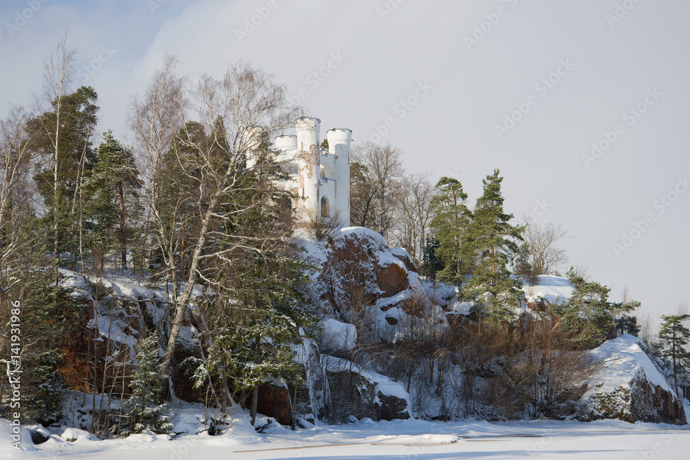 A view of the Island of the Dead and the Ludwigstein chapel on a cloudy February day. Monrepos Park in Vyborg, Russia