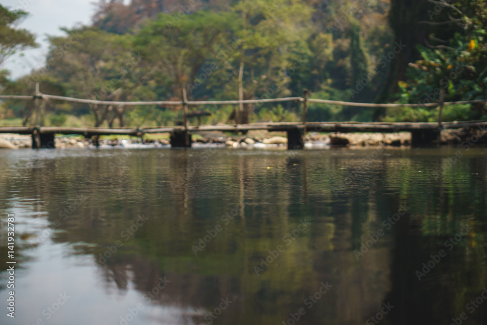 Obraz premium bamboo bridge over the river