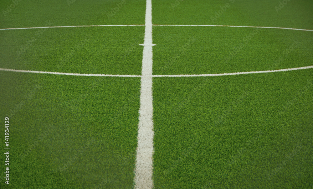 Green artificial grass soccer field
