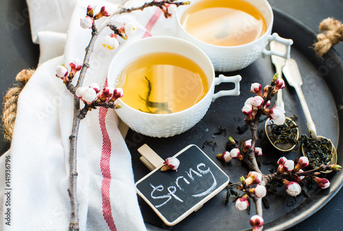 Green tea and peach blossom as a spring concept