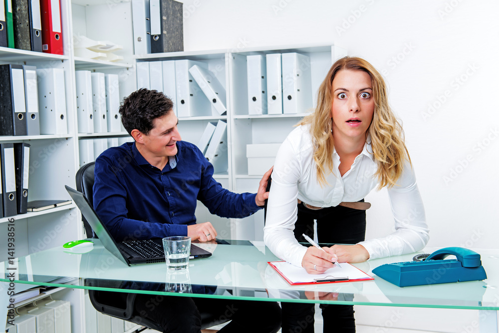 sexual harassment in office- man touch female colleague at butto sexual harassment in office- man touch female colleague at butto