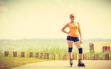 Young woman rollerblading outdoor on sunny day