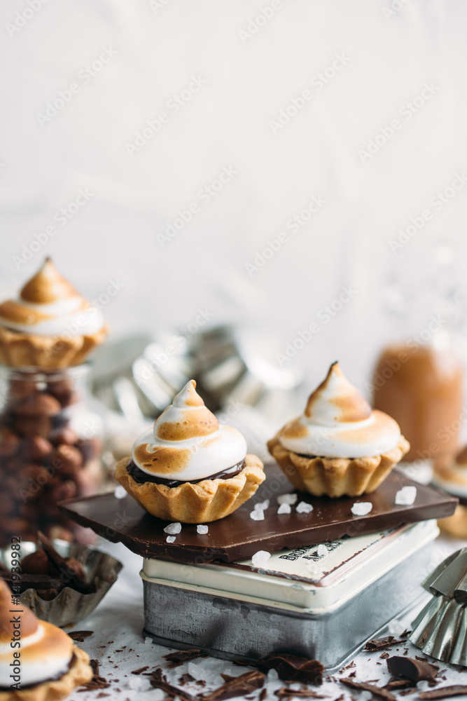 Chocolate Tartlets with nuts and Italian meringue
