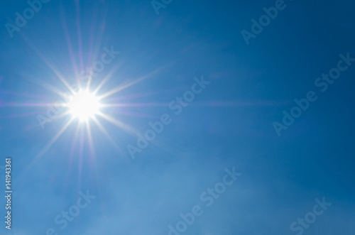 sun light flare on blue sky background