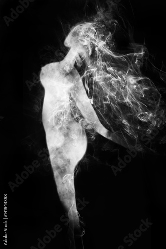 White smoke is shaped like a naked woman on black background.