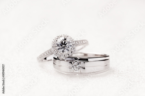 фотографія Bride and groom wedding engagement rings on white background