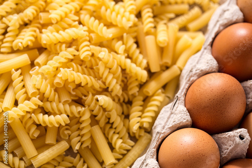 top view of Macaroni Pasta and fresh eggs.