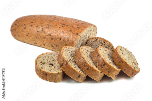 Dark rye bread with seeds on white background