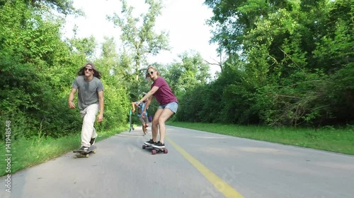 Wallpaper Mural Front view of three cool cheerful friends skateboarding  Torontodigital.ca