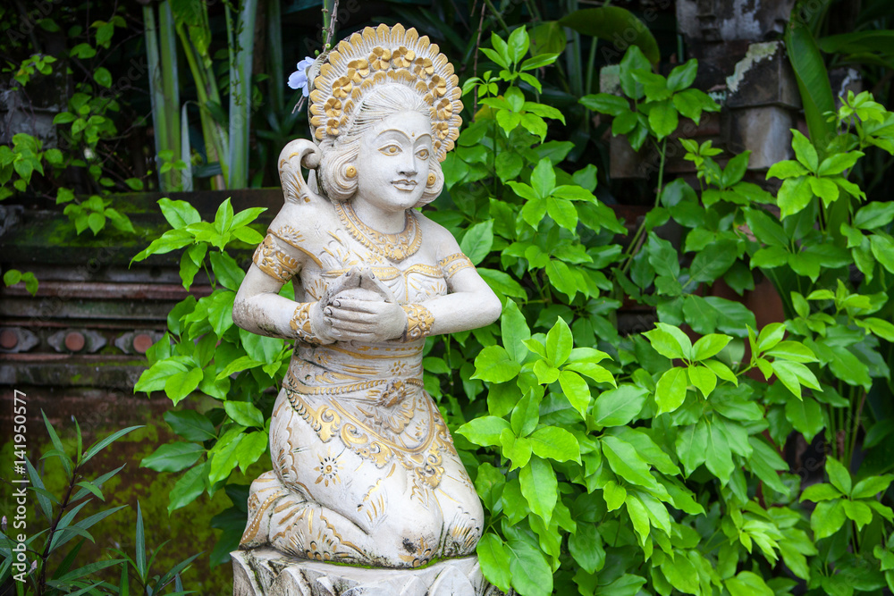 Girl statue in white stone in Balinese style Girl statue in white stone in Balinese style