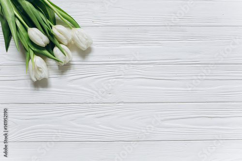 Tulips on a white wooden background for Mother s Day.